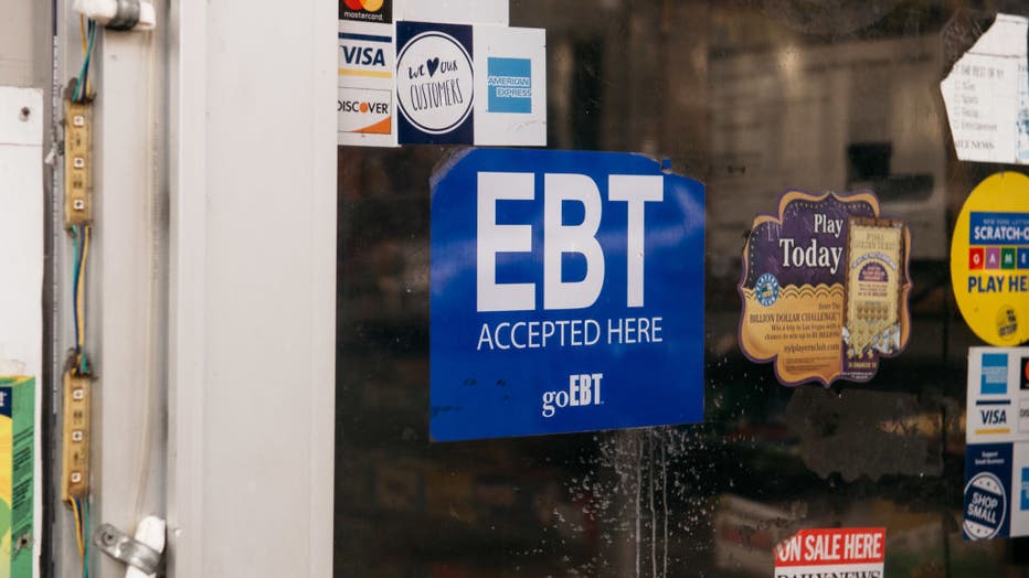 FILE - A sign alerting customers about SNAP food stamps benefits is displayed at a Brooklyn grocery store on Dec. 5, 2019 in New York City. (Photo by Scott Heins/Getty Images)