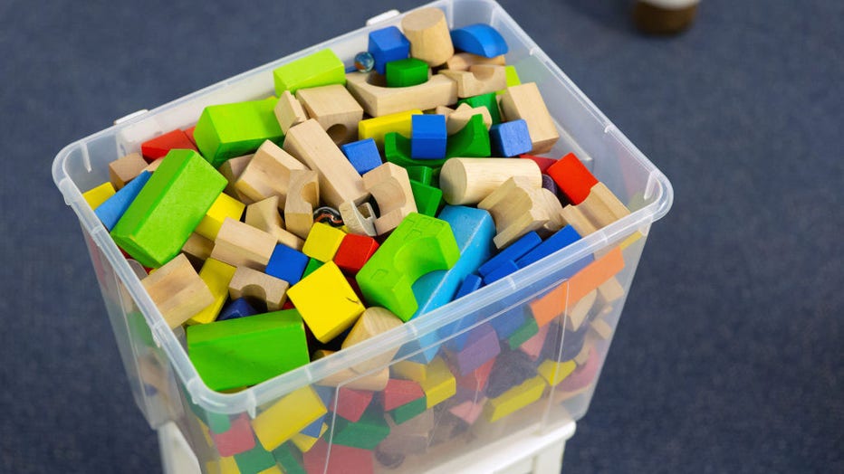 FILE - A box of colorful building blocks stands in a daycare center. (Photo by Friso Gentsch/picture alliance via Getty Images)