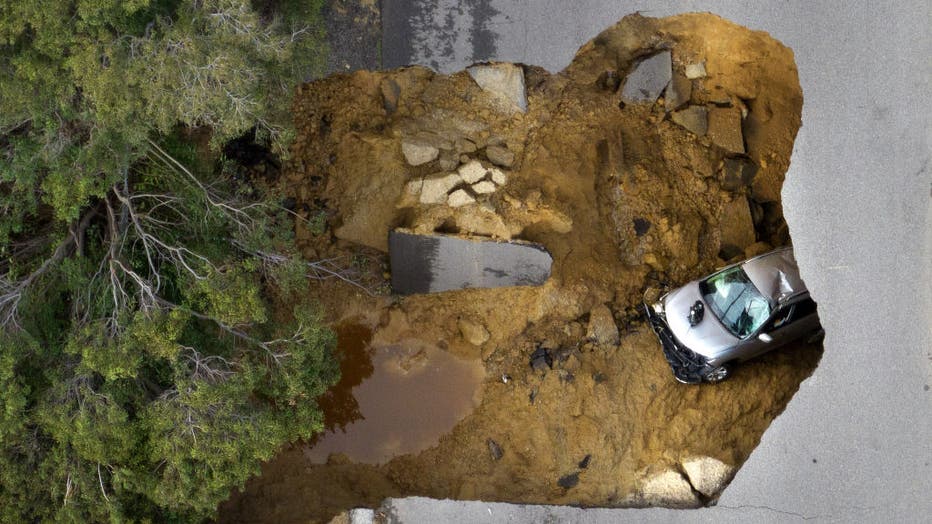 Two vehicles fell into a sinkhole on Jan. 10, 2023 in Chatsworth, CA. (Myung J. Chun / Los Angeles Times via Getty Images)