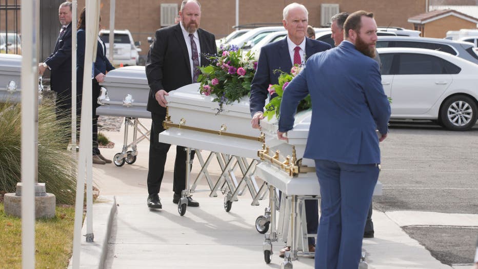 Pallbearers wheel caskets from the chapel of the Church of Jesus Christ of Latter-Day Saints after the funeral of the Haight family on Jan. 13, 2023, in La Verkin, Utah. (Photo by George Frey/Getty Images)