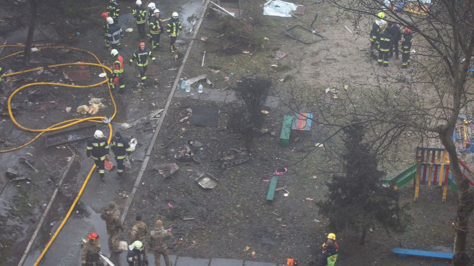 Firefighters work on the site where a helicopter crashed in the Brovary city of Ukraine’s Kyiv region on Jan. 18, 2023. (Photo by Oleksii Chumachenko/Anadolu Agency via Getty Images)