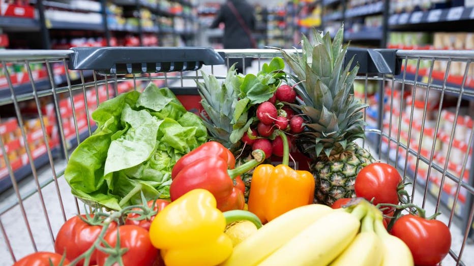 FILE IMAGE - A shopping basket with fruits and vegetables is pictured at a grocery store. (Photo by Sebastian Kahnert/picture alliance via Getty Images)