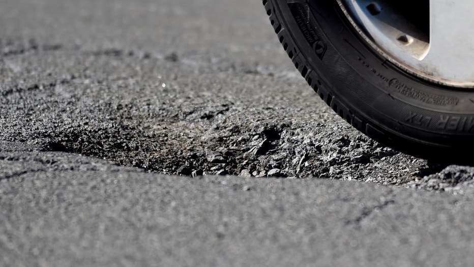 FILE - A pothole in the street in Reading, PA, on Feb. 25, 2021. (Photo by Ben Hasty/MediaNews Group/Reading Eagle via Getty Images)