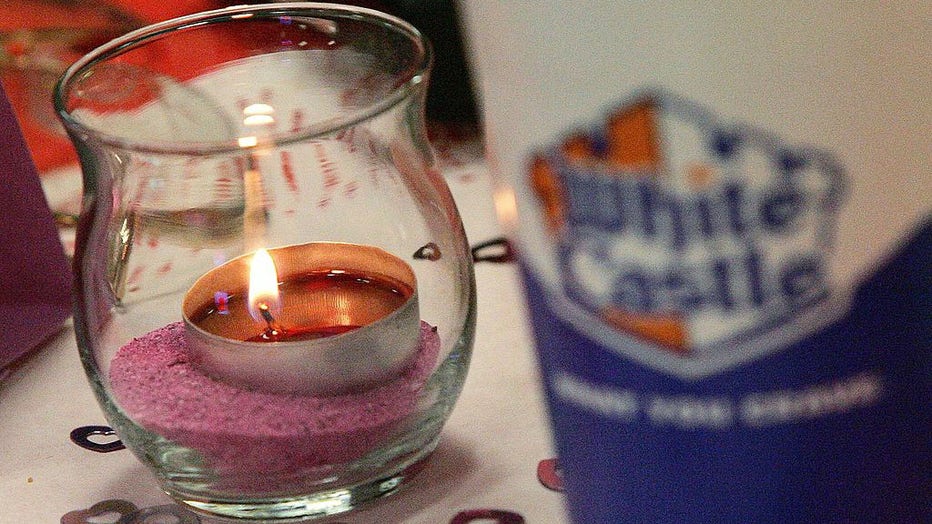 FILE IMAGE - A candle is seen next to a White Castle soft-drink cup during a Valentine's Day dinner at a White Castle restaurant on Feb. 14, 2006, in Des Plaines, Illinois. (Photo by Tim Boyle/Getty Images)