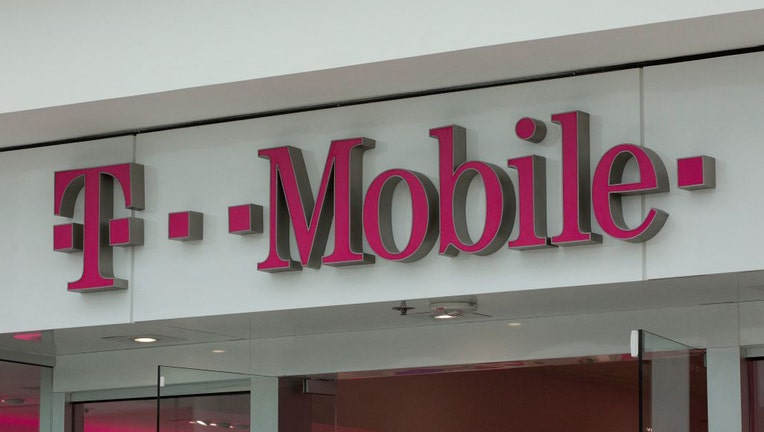 FILE - The T-Mobile logo is seen outside a shop in Washington, DC, on July 26, 2019. (Photo by ALASTAIR PIKE/AFP via Getty Images)