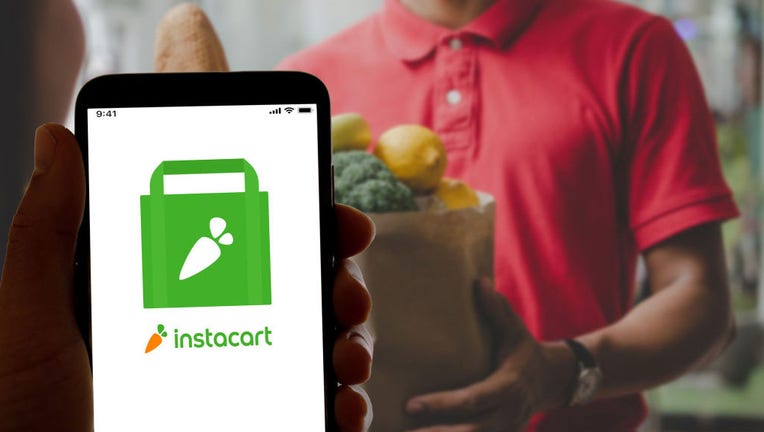 FILE - In this photo illustration, the logo of the food and grocery delivery app Instacart seen displayed on a smartphone screen and on a laptop. (Photo Illustration by Davide Bonaldo/SOPA Images/LightRocket via Getty Images)