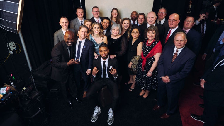 Damar Hamlin poses for a photo with University of Cincinnati medical staff during NFL Honors at the Symphony Hall on Feb. 9, 2023, in Phoenix, Arizona. (Photo by Cooper Neill/Getty Images)