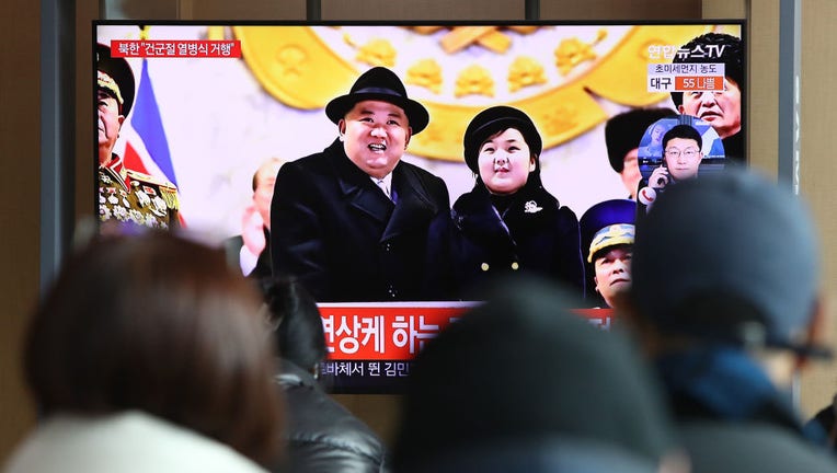 People watch a television show North Korea's 75th anniversary of the founding of the armed forces day military parade released by Korean Central News Agency (KCNA) at the Seoul Railway Station on Feb. 9, 2023, in Seoul, South Korea. (Photo by Chung Sung-Jun/Getty Images)