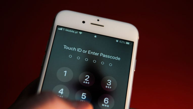 FILE - An iPhone prompting to enter the passcode is seen on Oct. 25, 2017. (Photo by Jaap Arriens/NurPhoto via Getty Images)