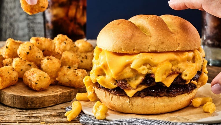 The S'Mac & Cheese Burger at Smashburger is an item made with certified Angus beef, American cheese, macaroni and cheese and a toasted bun. (Smashburger)