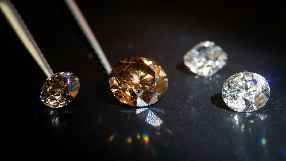 FILE - This picture taken on Sept. 23, 2019, in Paris, shows lab-grown diamonds in the headquarters of the Diam-Concept company. (Photo by LIONEL BONAVENTURE/AFP via Getty Images)