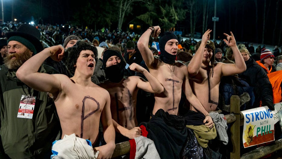 Landon Cook, Aiden Cameron, Sawyer Hall and Matt Grusky cheer during a concert on Feb. 2, 2023, in Punxsutawney, Pennsylvania. (Photo by Michael Swensen/Getty Images)