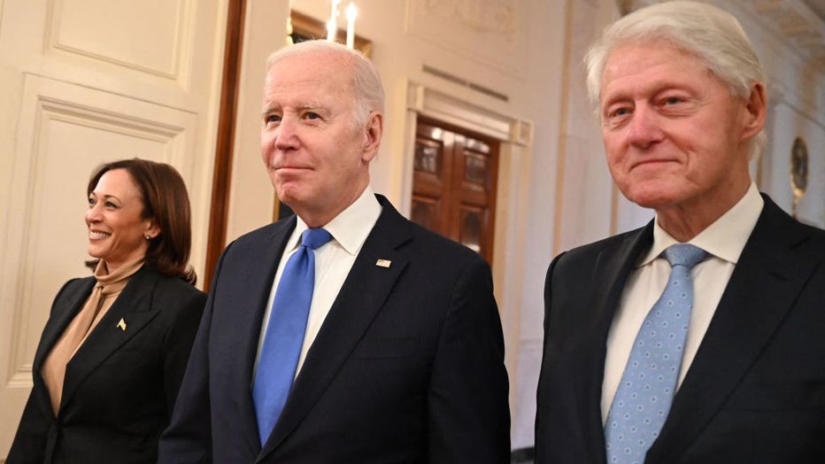 (L-R) US Vice President Kamala Harris, US President Joe Biden, and former US President Bill Clinton arrive for an event marking the 30th Anniversary of the Family and Medical Leave Act, in the East Room of the White House in Washington, DC, on Feb. 2, 2023. (Photo by ANDREW CABALLERO-REYNOLDS/AFP via Getty Images)