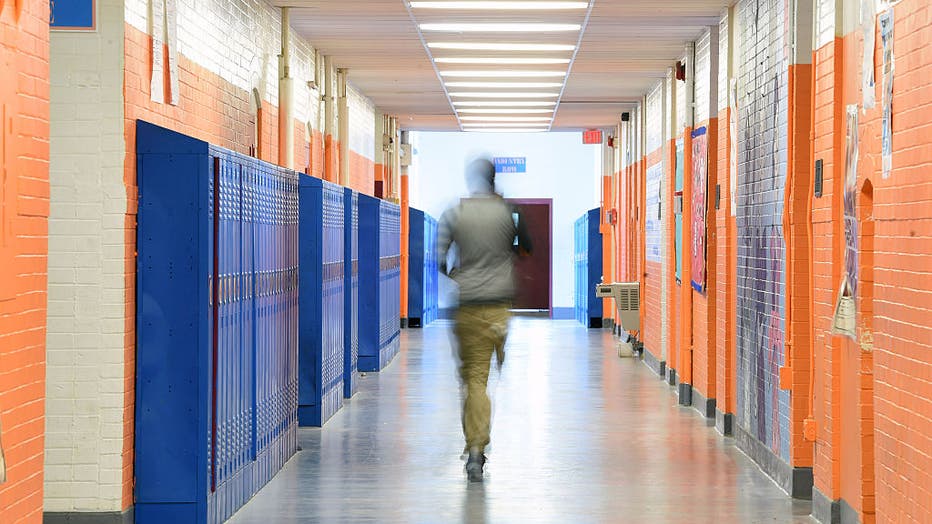 FILE - A high school student walks through a hallway on June 15, 2015, in Washington, D.C. (Photo by Matt McClain/ The Washington Post via Getty Images)