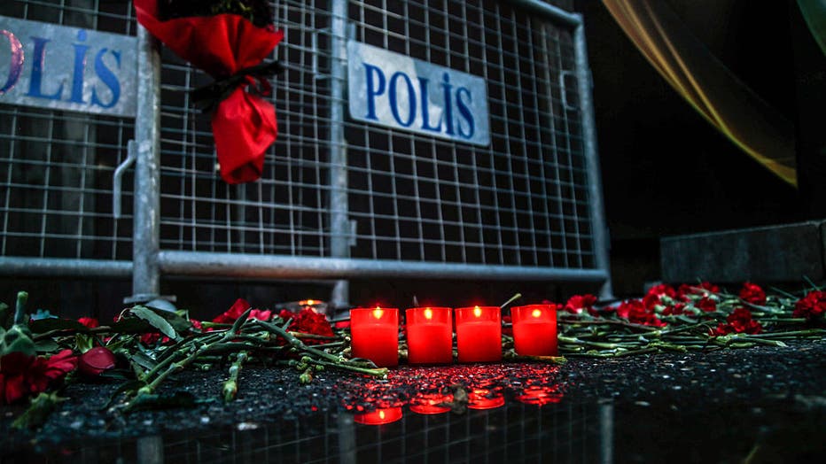 Flowers and candles are placed outside the Reina nightclub by the Bosphorus, following a gun attack on New Year's Eve, on January 1, 2017, in Istanbul, Turkey. (Photo by Daghan Kozanoglu/Getty Images)