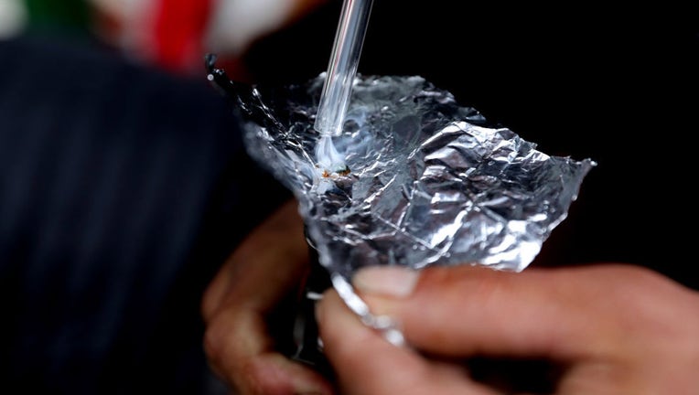 FILE - A person smokes fentanyl on May 3, 2022, in Vancouver, British Columbia. (Gary Coronado / Los Angeles Times via Getty Images)