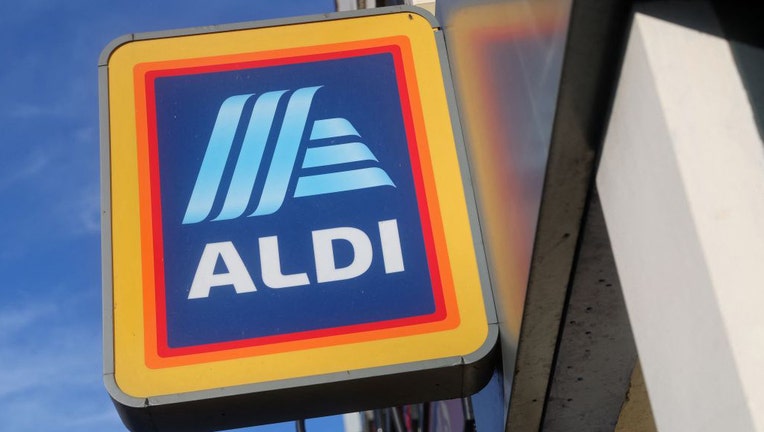 FILE - Signage is pictured outside an Aldi store in London on Jan. 2, 2023. (Photo by ISABEL INFANTES/AFP via Getty Images)