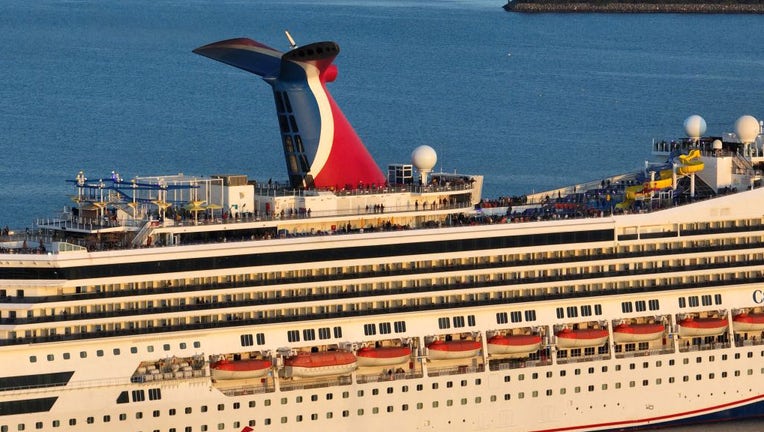 FILE - An aerial view of the Carnival Radiance, a Destiny-class cruise ship, as it heads out to sea in Long Beach at sunset on Feb. 17, 2023. (Allen J. Schaben / Los Angeles Times via Getty Images)