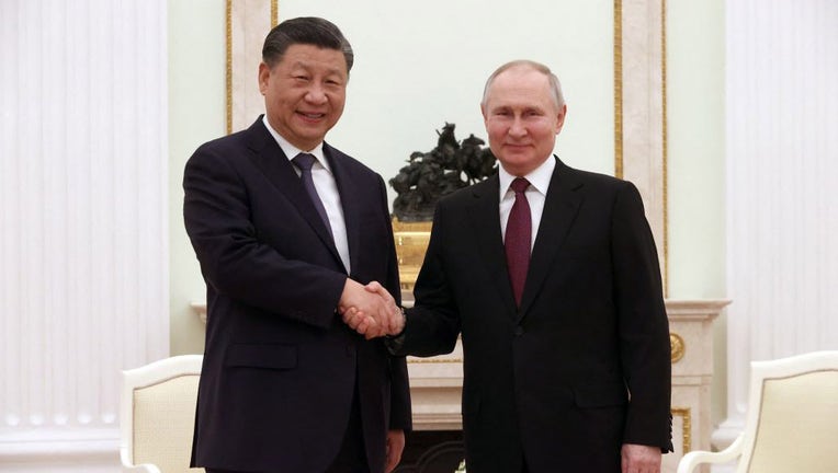 Russian President Vladimir Putin meets with Chinas President Xi Jinping at the Kremlin in Moscow on March 20, 2023. (Photo by SERGEI KARPUKHIN/SPUTNIK/AFP via Getty Images)