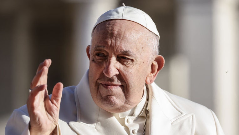 Pope Francis waves as he arrives on his popemobile to lead his weekly audience in St. Peters Square at the Vatican, on March 29, 2023. Photographer: Alessia Pierdomenico/Bloomberg via Getty Images