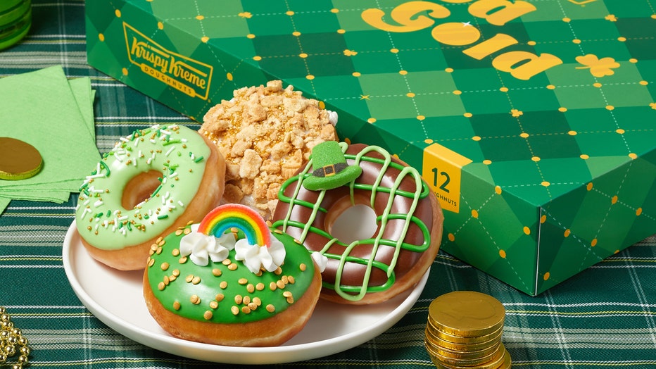 Four all-new, gold-themed doughnuts come in decorative holiday dozens box. (Photo: Krispy Kreme via Business Wire)