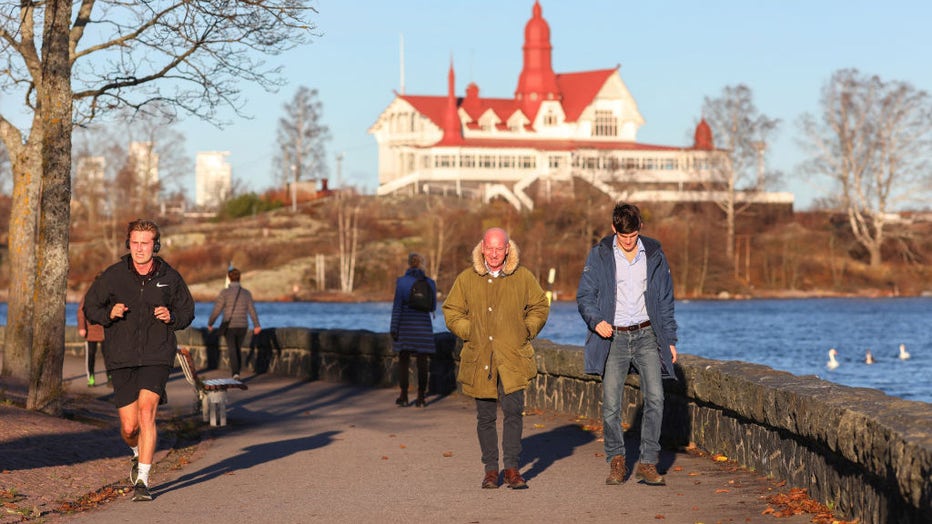 FILE IMAGE - People walk along the promenade on a sunny day on Nov. 12, 2022, in Helsinki, Finland. (Photo by Takimoto Marina/SOPA Images/LightRocket via Getty Images)