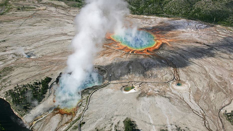 An aerial photograph of Excelsior Geyser and Grand Prismatic Spring in the Midway Geyser Basin, Yellowstone National Park, Wyoming, June 22, 2006. (Photo via Smith Collection/Gado/Getty Images).