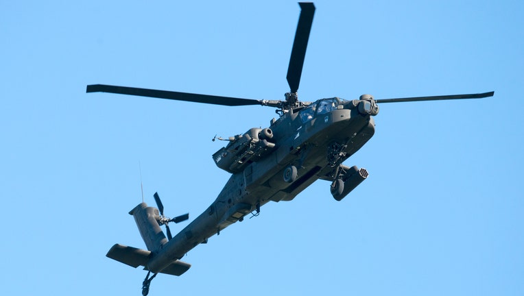 FILE IMAGE - An AH-64 Apache attack helicopter conducts flight operations at Travis Air Force Base, Calif., Jan, 6, 2017. (U.S. Air Force photo/Heide Couch)