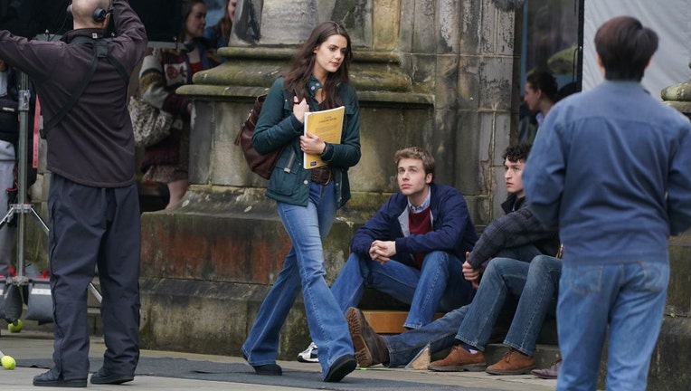 Actress Meg Bellamy, who plays Kate Middleton, and actor Ed McVey, who plays the part of Prince William, film scenes for the next season of The Crown in St Andrews in Scotland. Picture date: March 17, 2023. (Photo by Andrew Milligan/PA Images via Getty Images)