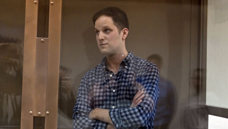 US journalist at Wall Street Journal Evan Gershkovich, arrested on spying charges, stands inside a defendants cage before a hearing to consider an appeal on his arrest at the Moscow City Court in Moscow, Russia on April 18, 2023. (Photo by Sefa Karacan/Anadolu Agency via Getty Images)