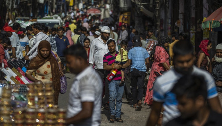 People walk through the Sadar Bazaar in New Delhi, India, on Tuesday, April 18, 2023. Photo: Prashanth Vishwanathan/Bloomberg via Getty Images