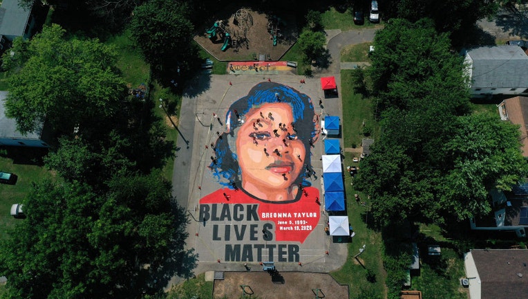 FILE - In an aerial view from a drone, a large-scale ground mural depicting Breonna Taylor with the text Black Lives Matter is seen being painted at Chambers Park on July 5, 2020, in Annapolis, Maryland. (Photo by Patrick Smith/Getty Images)