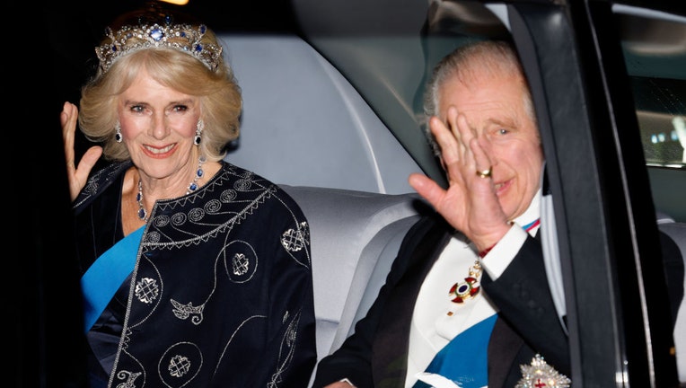 FILE - King Charles III and Camilla, Queen Consort, arrive at the annual Reception for Members of the Diplomatic Corps at Buckingham Palace on Dec. 6, 2022, in London, England. (Photo by Max Mumby/Indigo/Getty Images)