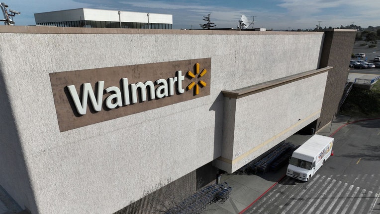 FILE - In an aerial view, a sign is seen posted on the exterior of a Walmart store on Feb. 21, 2023, in Richmond, California. (Photo by Justin Sullivan/Getty Images)
