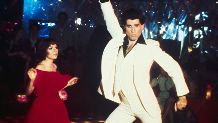 Actor John Travolta dancing with actress Karen Gorney in the movie "Saturday Night Fever" in a file image dated Feb. 27, 1978. (Credit: Getty Images)