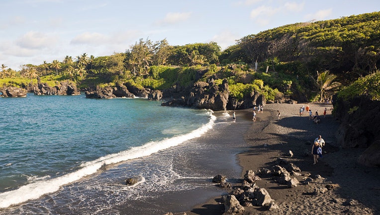 FILE - Black Sand Beach at Waianapanapa State Park on Road to Hana, Maui, Hawaii. (Photo by Reinhard Dirscherl/ullstein bild via Getty Images)