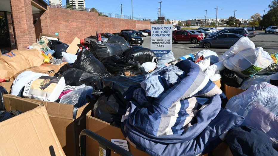 FILE - Bags of donated items are piled up at a Goodwill donation center in Washington, DC, November 16, 2019. (Photo by EVA HAMBACH/AFP via Getty Images)