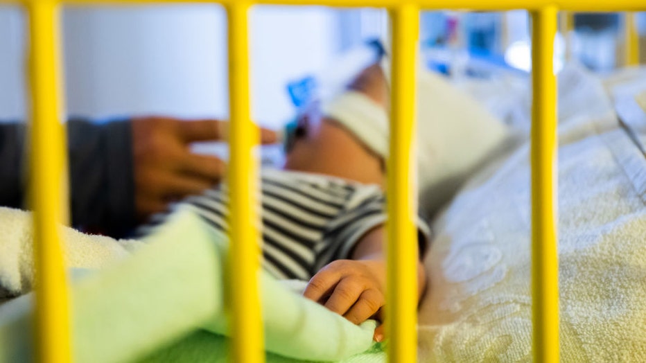 FILE - A baby is pictured in the intensive care unit at a hospital with a respiratory infection. (Photo by Christoph Soeder/picture alliance via Getty Images)