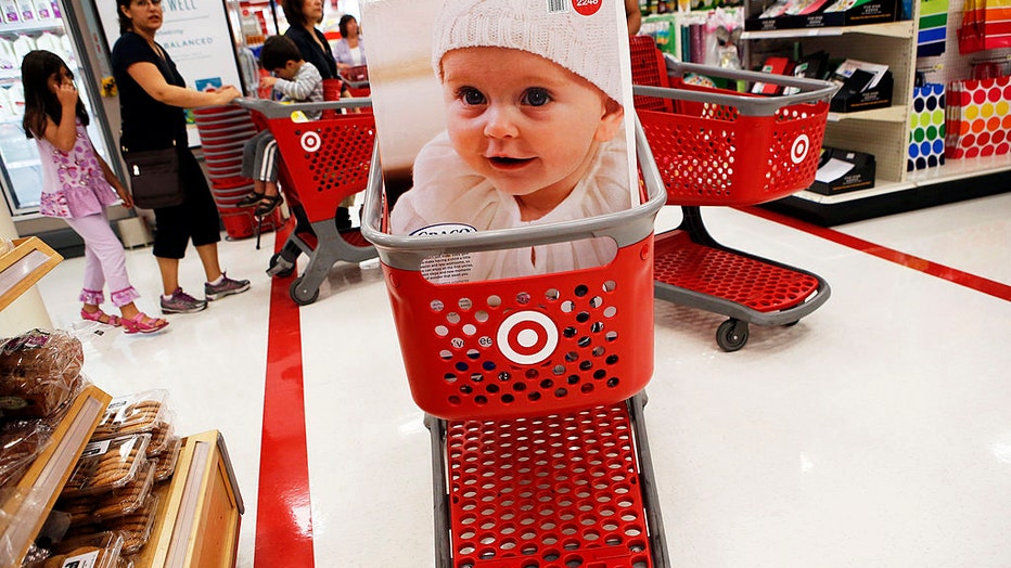FILE - A customer's cart carries a children's car safety seat inside the Target Corp. Store in Torrance, California, on August 20, 2013. Photographer: Patrick T. Fallon/Bloomberg via Getty Images