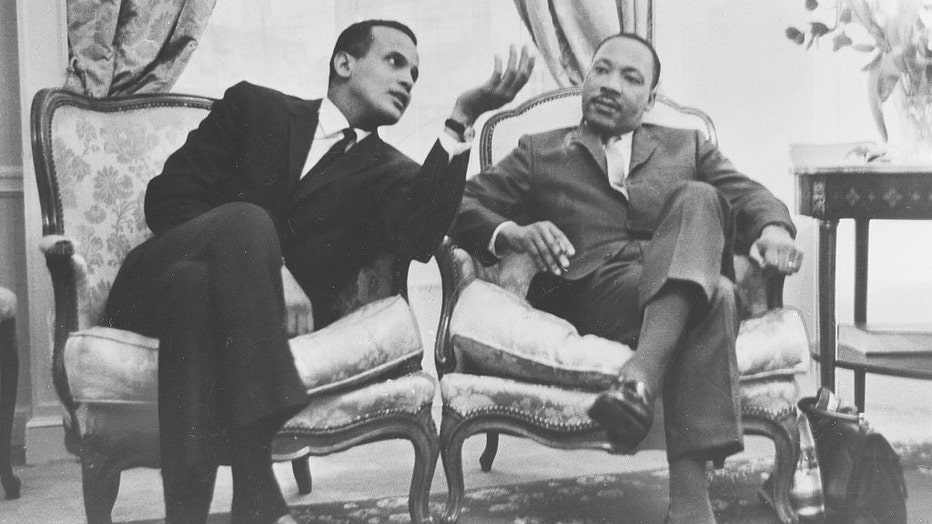 FILE - Martin Luther King, Jr. photographed in Paris, 1966, with singer Harry Belafonte (left). (Photo by ullstein bild via Getty Images)