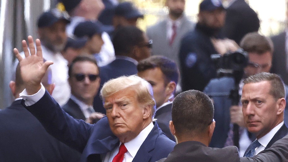 NEW YORK, NEW YORK - APRIL 04: Former U.S. President Donald Trump waves as he arrives at the Manhattan Criminal Court on April 04, 2023 in New York, New York. Trump will be arraigned during his first court appearance today following an indictment by a grand jury that heard evidence about money paid to adult film star Stormy Daniels before the 2016 presidential election. With the indictment, Trump becomes the first former U.S. president in history to be charged with a criminal offense. (Photo by Kena Betancur/Getty Images)