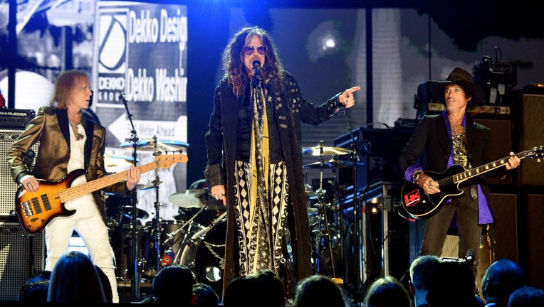 FILE - Tom Hamilton, Steven Tyler, and Joe Perry of Aerosmith perform during the 62nd Annual GRAMMY Awards at STAPLES Center on Jan. 26, 2020, in Los Angeles, California. (Photo by Kevin Mazur/Getty Images for The Recording Academy)