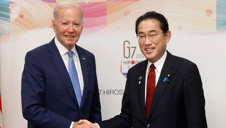 FILE - US President Joe Biden (L) and Fumio Kishida, Japans prime minister, shake hands prior to a bilateral meeting ahead of the Group of Seven (G7) leaders summit on May 18, 2023 in Hiroshima, Japan. The G7 summit will be held in Hiroshima from 19-22 May. (Photo by Kiyoshi Ota/Pool/Getty Images)