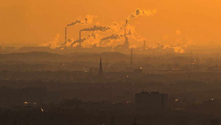 FILE - Steam and exhaust rise from different companies on a cold winter day on Jan. 6, 2017, in Oberhausen, Germany. (Photo by Lukas Schulze/Getty Images)