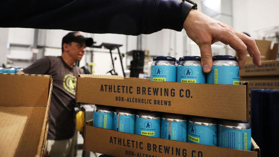 FILE - ans of beer are packed at Athletic Brewing’s non-alcoholic brewery and production plant on March 20, 2019, in Stratford, Connecticut. (Photo by Spencer Platt/Getty Images)