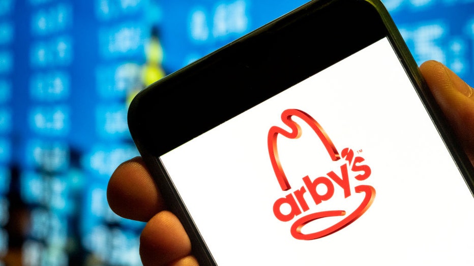 FILE - In this photo illustration, the American fast-food sandwich restaurant chain Arbys logo is displayed on a smartphone screen. (Photo Illustration by Budrul Chukrut/SOPA Images/LightRocket via Getty Images)
