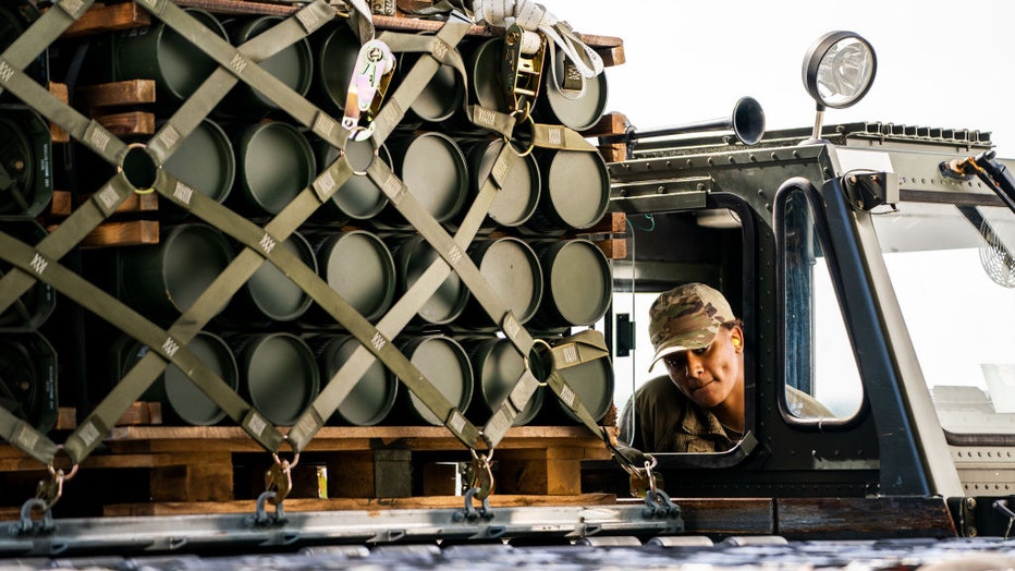 FILE - Airman load pallets of ammunition, weapons and other equipment bound for Ukraine on a commercial airline at Dover Air Force Base in Dover, Delaware on Oct. 12, 2022. (Photo by Demetrius Freeman/The Washington Post via Getty Images)