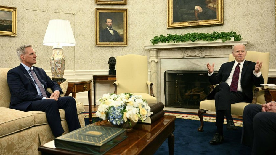 FILE - US President Joe Biden (R) meets with US Speaker of the House Kevin McCarthy in the Oval Office of the White House in Washington, DC, on May 9, 2023. (Photo by BRENDAN SMIALOWSKI/AFP via Getty Images)