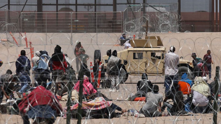 Migrant people camp on the banks of the Rio Grande as they wait to be processed by the Border Patrol El Paso Sector, Texas, after crossing from Ciudad Juarez, Mexico on May 9, 2023. (Photo by HERIKA MARTINEZ/AFP via Getty Images)