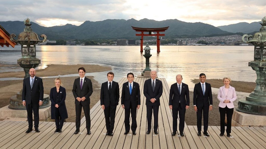 FILE - (L to R) European Council President Charles Michel, Italys Prime Minister Giorgia Meloni, Canadas Prime Minister Justin Trudeau, Frances President Emmanuel Macron, Japans Prime Minister Fumio Kishida, US President Joe Biden, Germanys Chancellor Olaf Scholz, Britains Prime Minister Rishi Sunak and European Commission President Ursula von der Leyen pose for a family photo as they pay a visit to Itsukushima Shrine on Miyajima island, near Hiroshima, during the G7 Summit Leaders Meeting on May 19, 2023. (Photo by JAPAN POOL/JIJI PRESS/AFP via Getty Images)